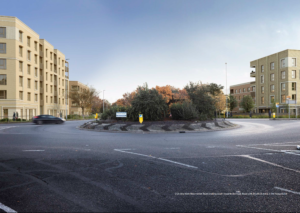 A a digital render of a tree planted roundabout in the foreground, flanked by light brick flats either side of the road.